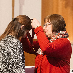 student receives honors medal from provost