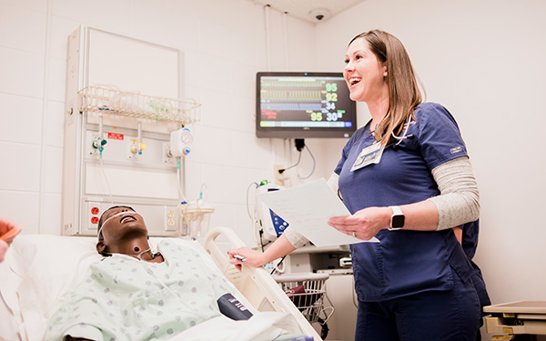 Nurse learning in hands on sim lab