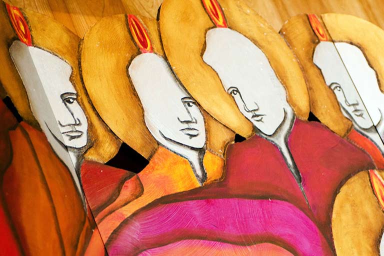 colorful art of the disciples of Jesus with flames above their heads in the St. John Francis Regis on the Northwest Denver Campus