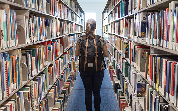 student in library