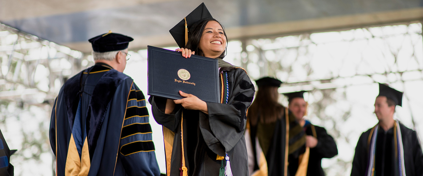 graduates walking at commencement