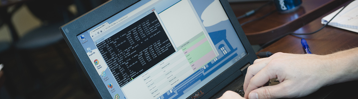 person inspecting code on computer