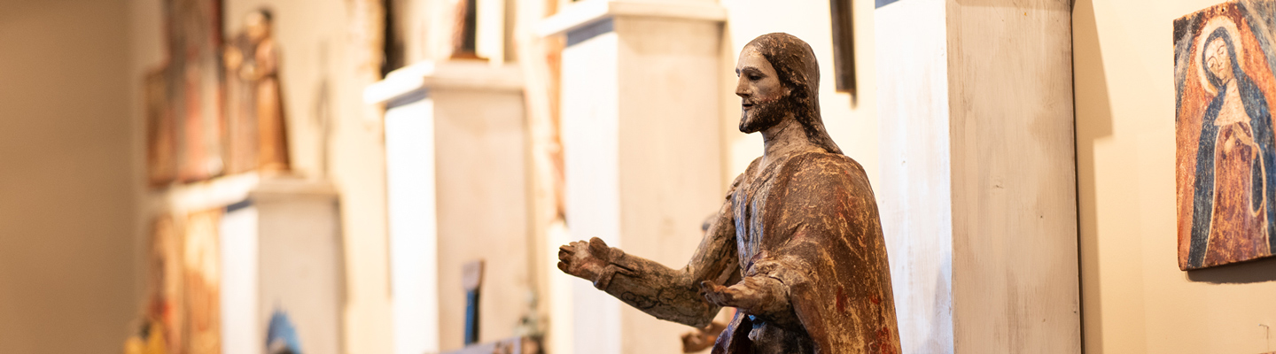 Statues of religious figures displayed inside the Regis campus chapel, reflecting Catholic tradition