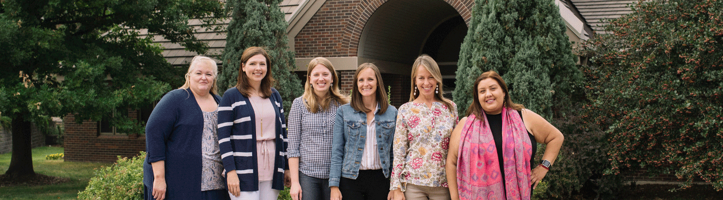 counseling team stand outside Coors