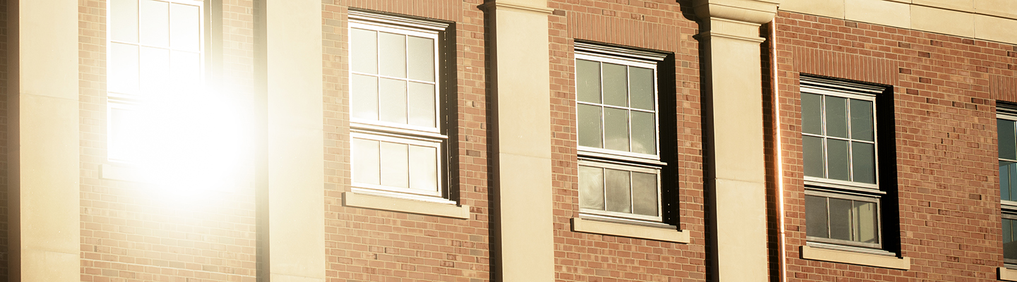 sun shining on clarke hall offices