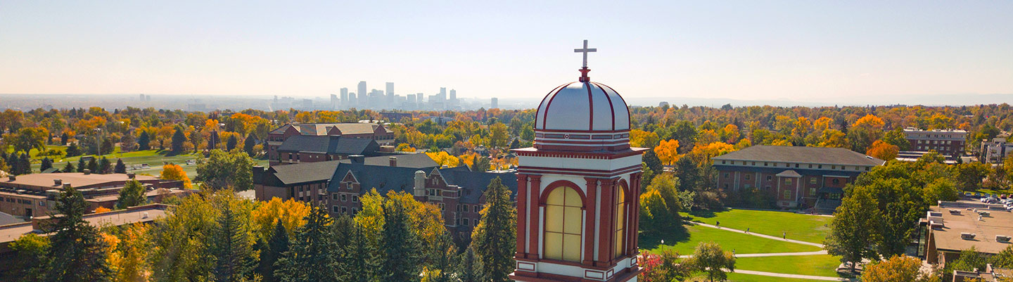 Regis University's Denver, Colorado, campus viewed from above on a clear fall day with the Denver skyline in the background