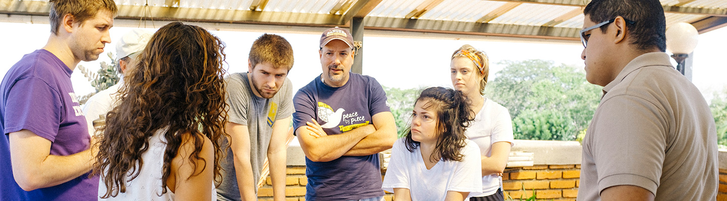 Regis corps members get instructions for service projects
