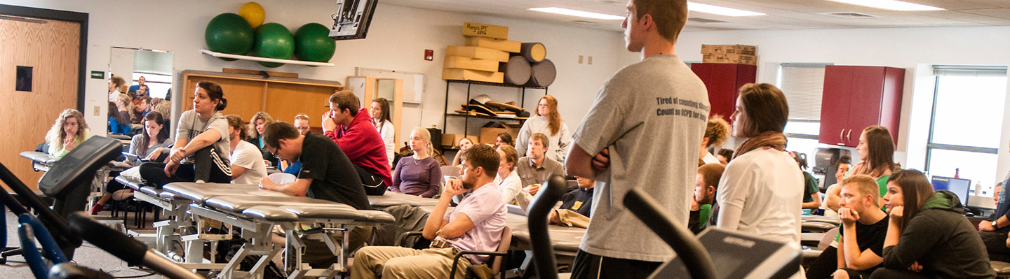 School of Physical Therapy - students use dumbells