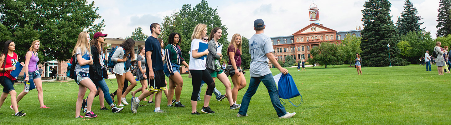 Students walking across the quad on a beautiful day