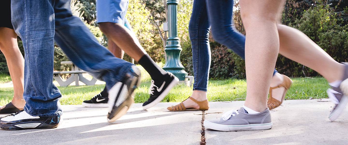 students walking on sidewalk