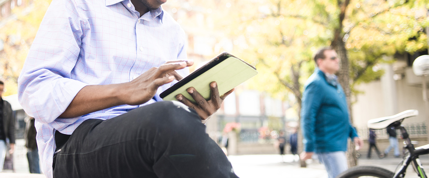 man holding ipad