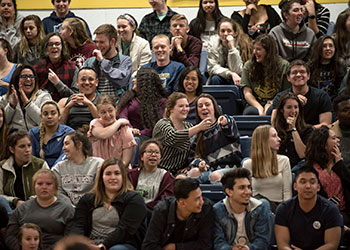 Alumni enjoying an event in the field house