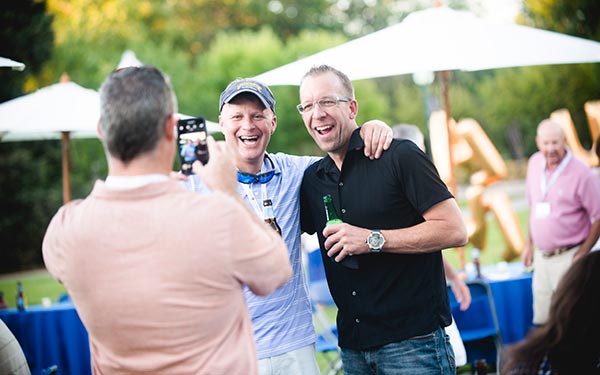 Alumni taking photos at an event