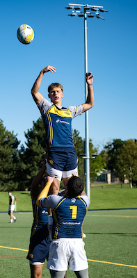 Rugby players competing and contesting the ball during a match. 