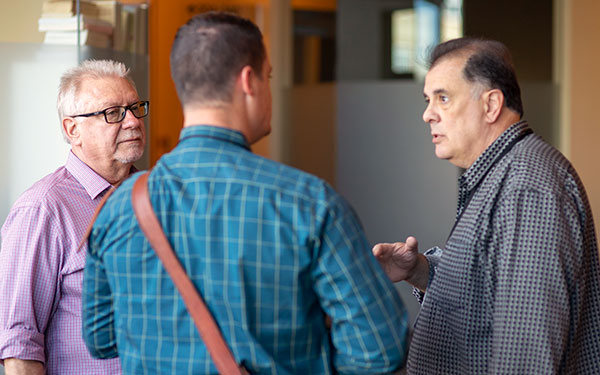 Bob Bowles and Christopher Garcia chat with a reporter