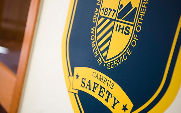 campus safety badge on the wall of the office