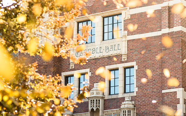 carroll hall behind fall leaves