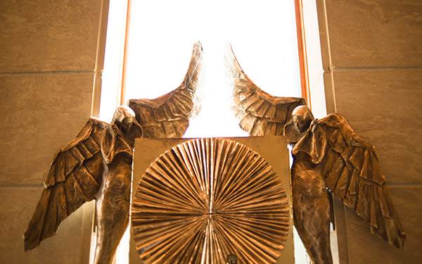 angels on baptismal font