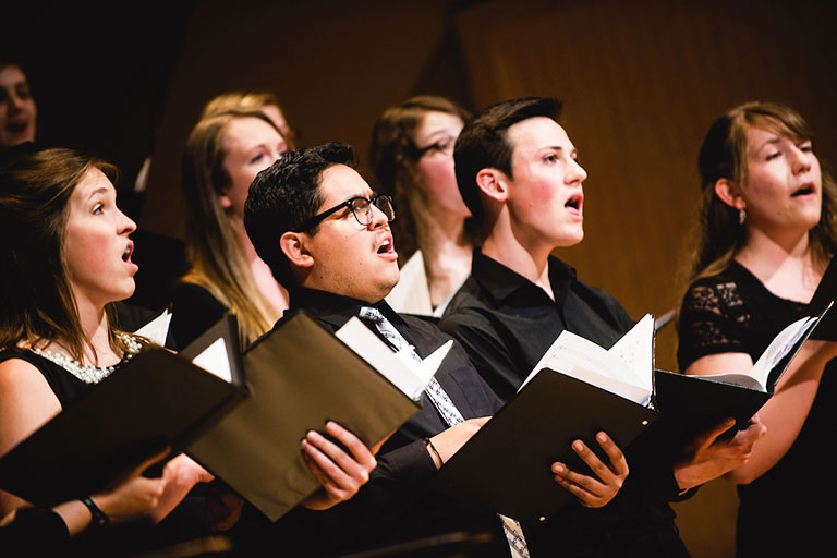 choral ensemble performing on stage