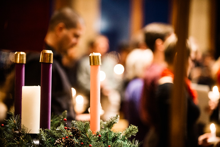 Christmas candles and fir leaves