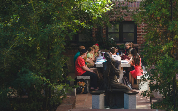 students in class outside in shade