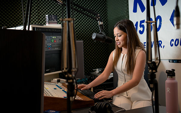 student speaking into microphone