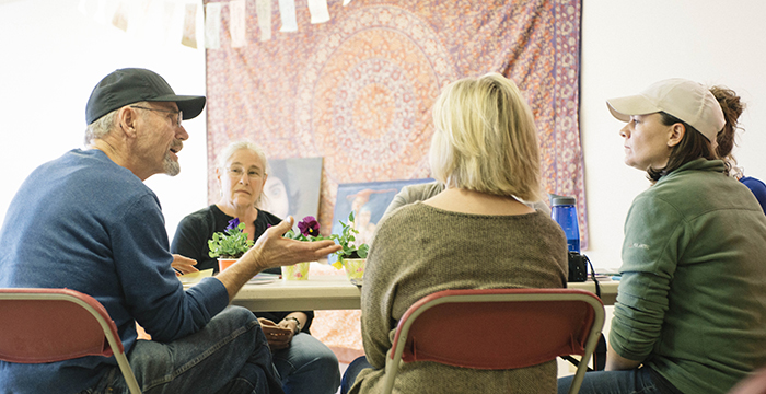 group of community members meeting at a round table