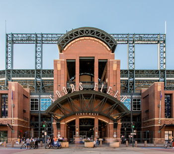 first base entrance of Coors Field, pedestrians crowding the walkway