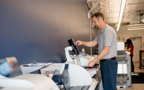 man working at printer