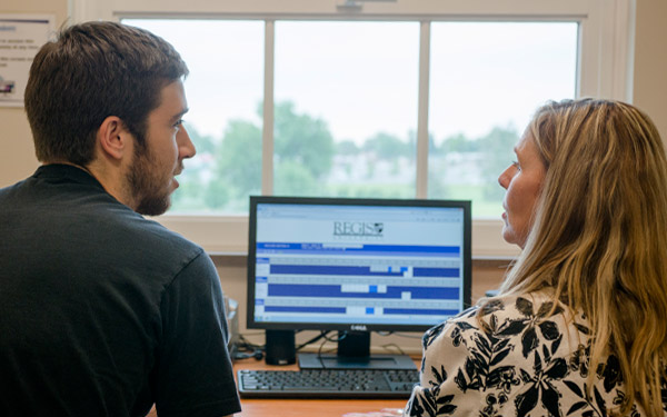 student at computer for testing services