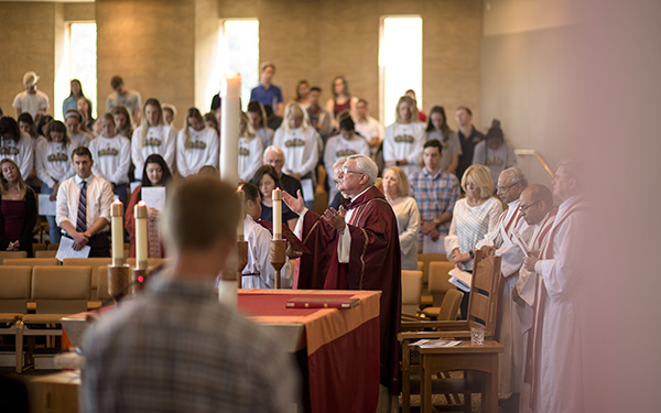 father fitz leading prayer in chapel