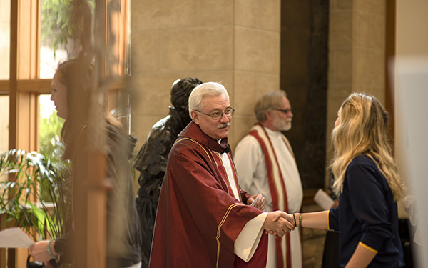father fitzgibbons shaking hands with people