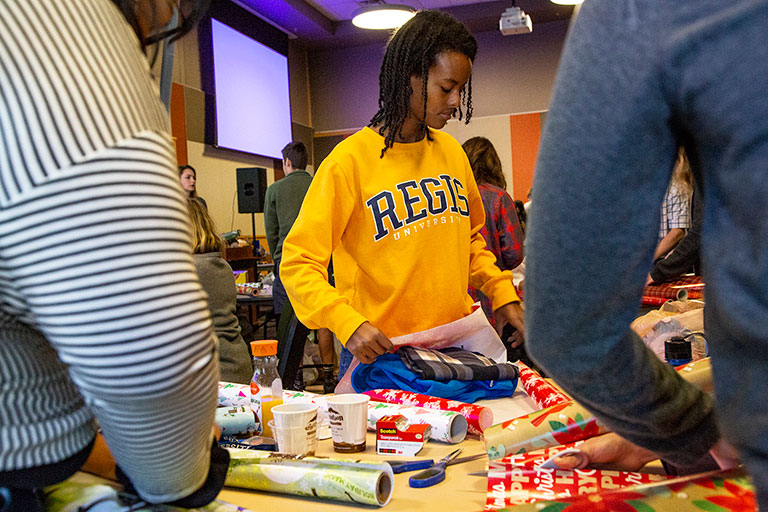 People wrapping presents for RUSS Christmas party