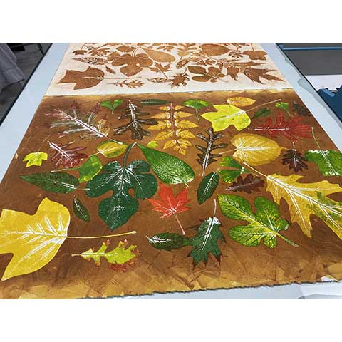 print of colorful leaves on the table