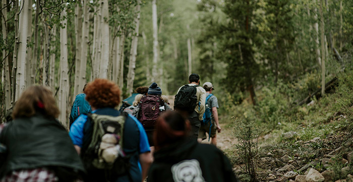 Students hiking up a trail