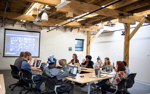 students sitting at conference table