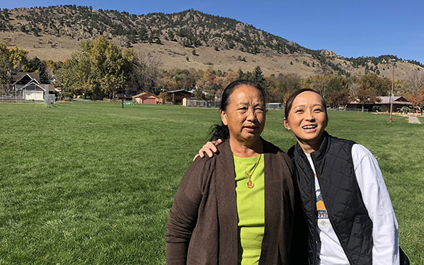 Hmong Nguyen and her mom pose for a photo outdoors