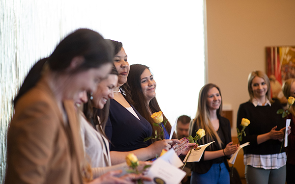 honors students smiling at a ceremony