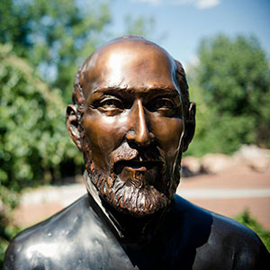 closeup of the face of a statue of St. Ignatius on the Northwest Denver campus