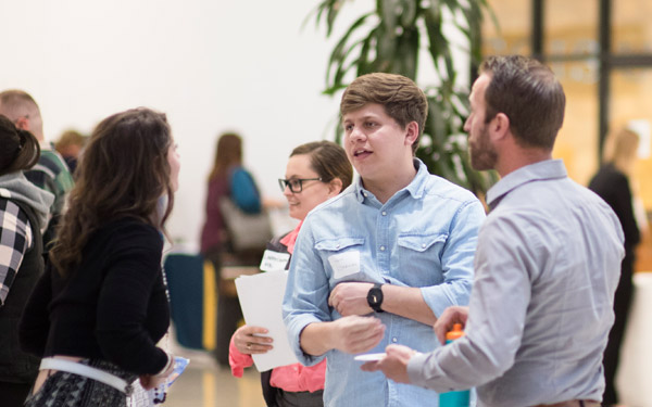 conversation between business professionals and student