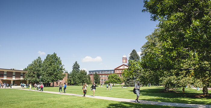 students cross quad