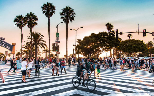pedestrians cross the street near Santa Monica Pier