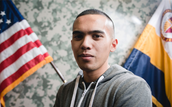 man in front of american flag