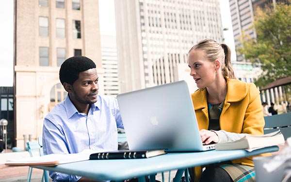 man and woman on computer