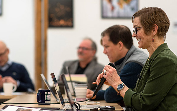 Photo of adult students sitting at table in OLLI class in session