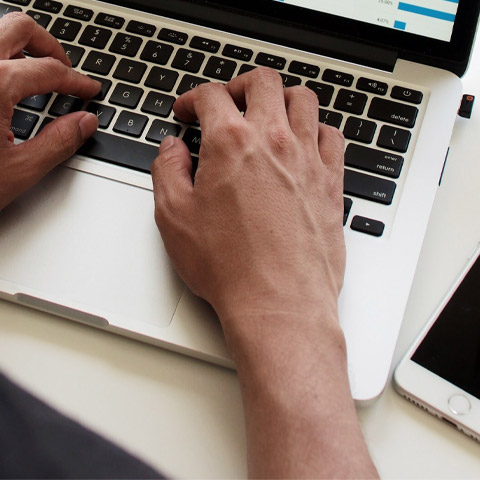 person typing on computer