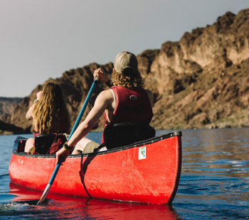 Regis students kayaking on a river