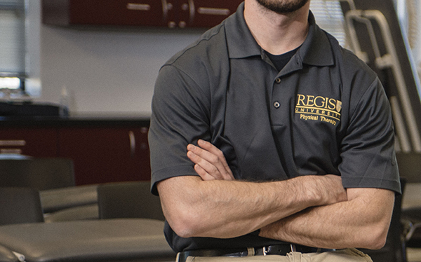 closeup of physical therapy student in regis shirt