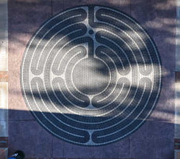 Overhead of prayer labyrinth with tree shadows across