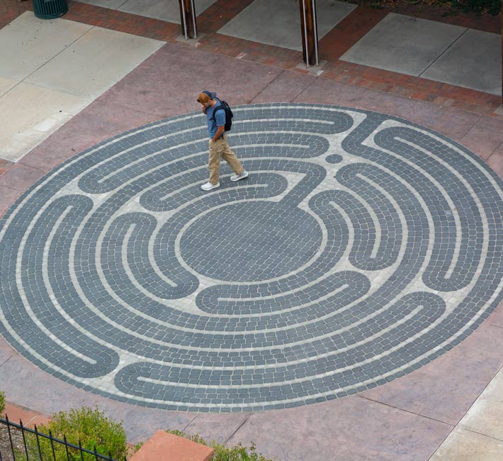 Person walking around the prayer labyrinth. Overhead view